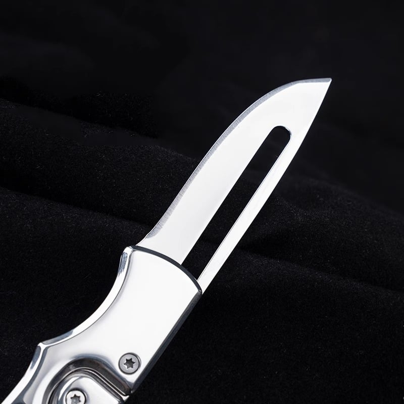Stainless steel folding mechanical magic knife