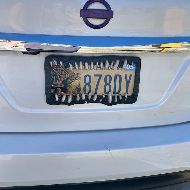 Creature teeth license plate