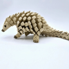 Wiggling Pangolin Ornament – Delightful Motion for Your Home