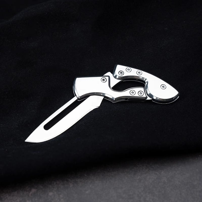 Stainless steel folding mechanical magic knife