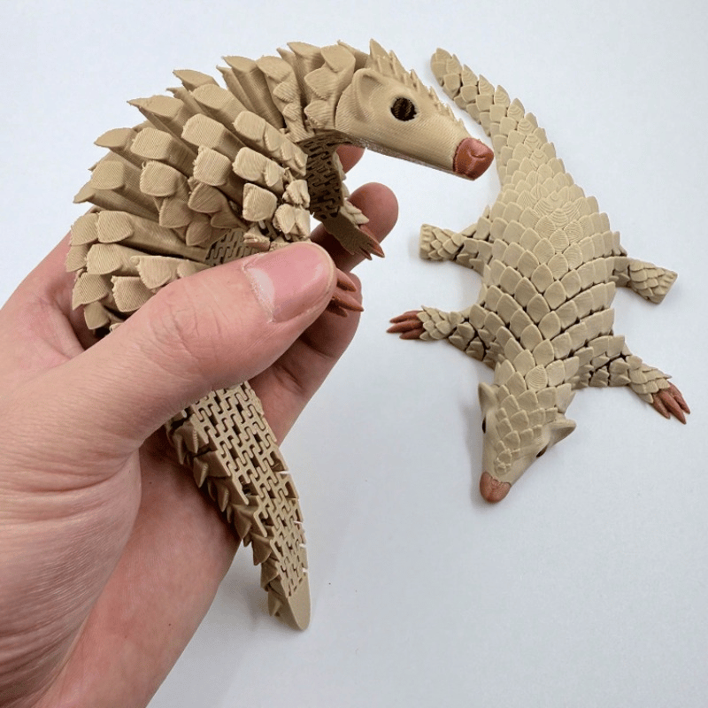 Wiggling Pangolin Ornament – Delightful Motion for Your Home