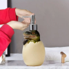 Dinosaur soap dispenser