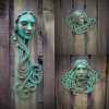 Art Nouveau inspired sculpture of beautiful female face with long stylised hair