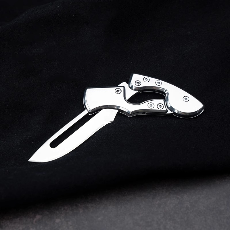 Stainless steel folding mechanical magic knife