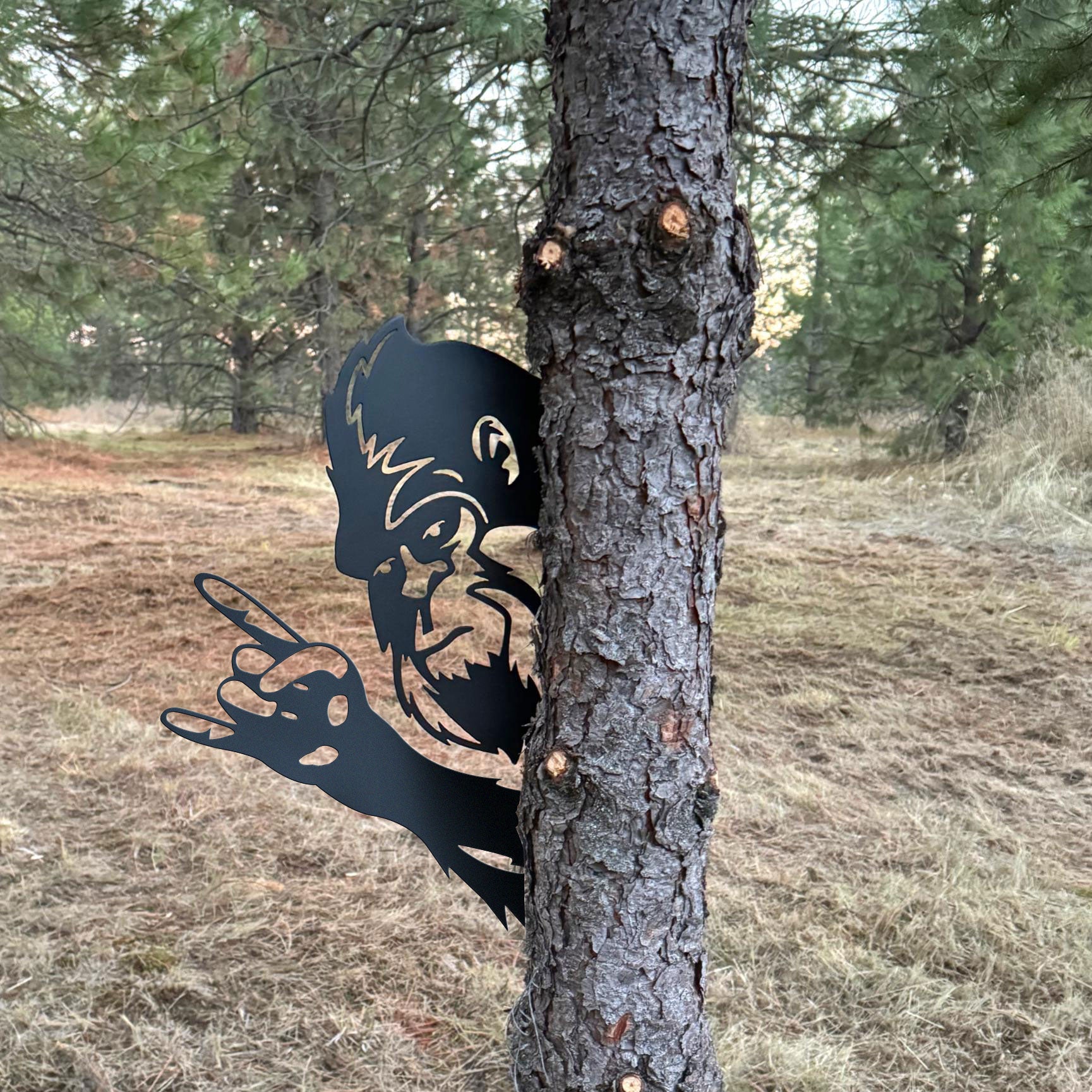 Bigfoot metal art showing middle finger