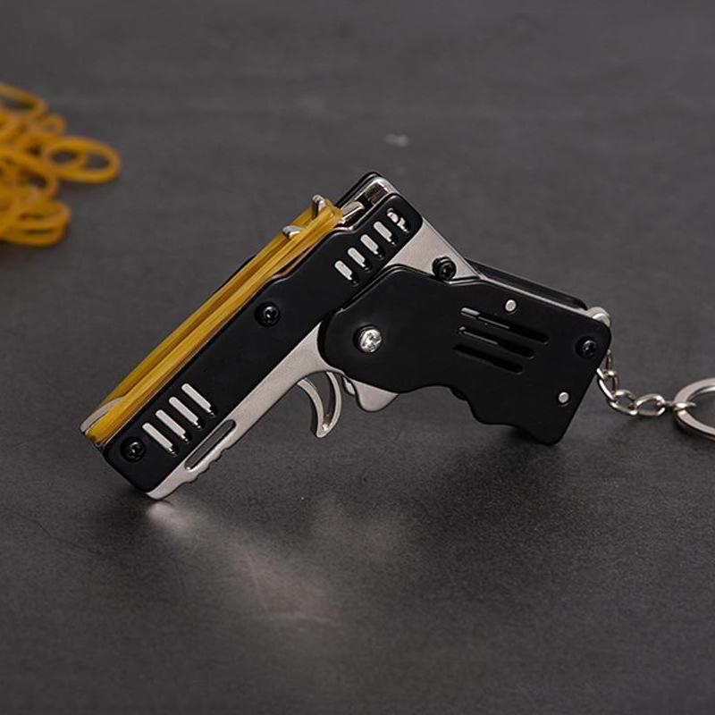 🔥Limited Time Sale 48% OFF🎉Folding Rubber Band Gun Toy Keychain(Buy 3 get extra 20% off)