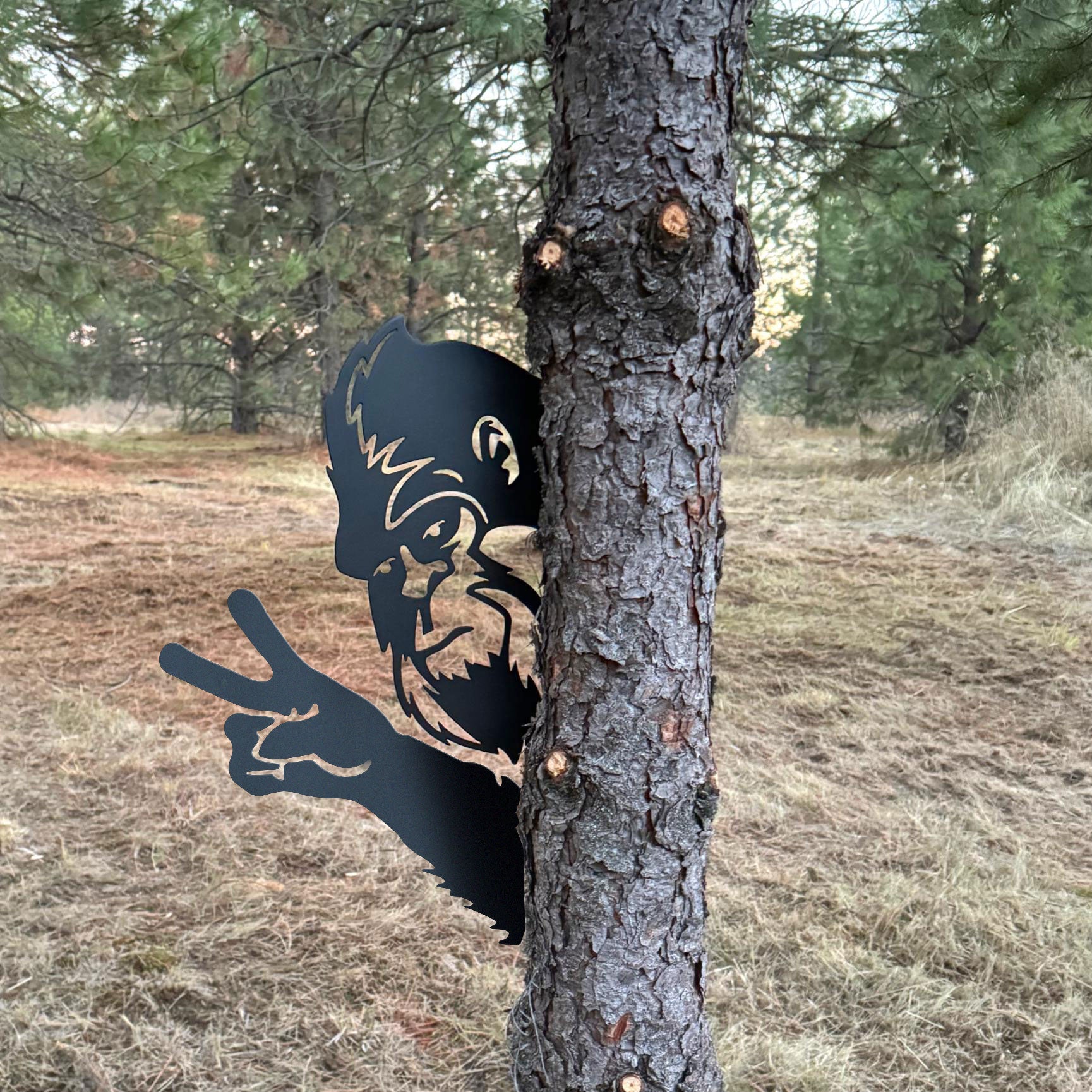 Bigfoot metal art showing middle finger