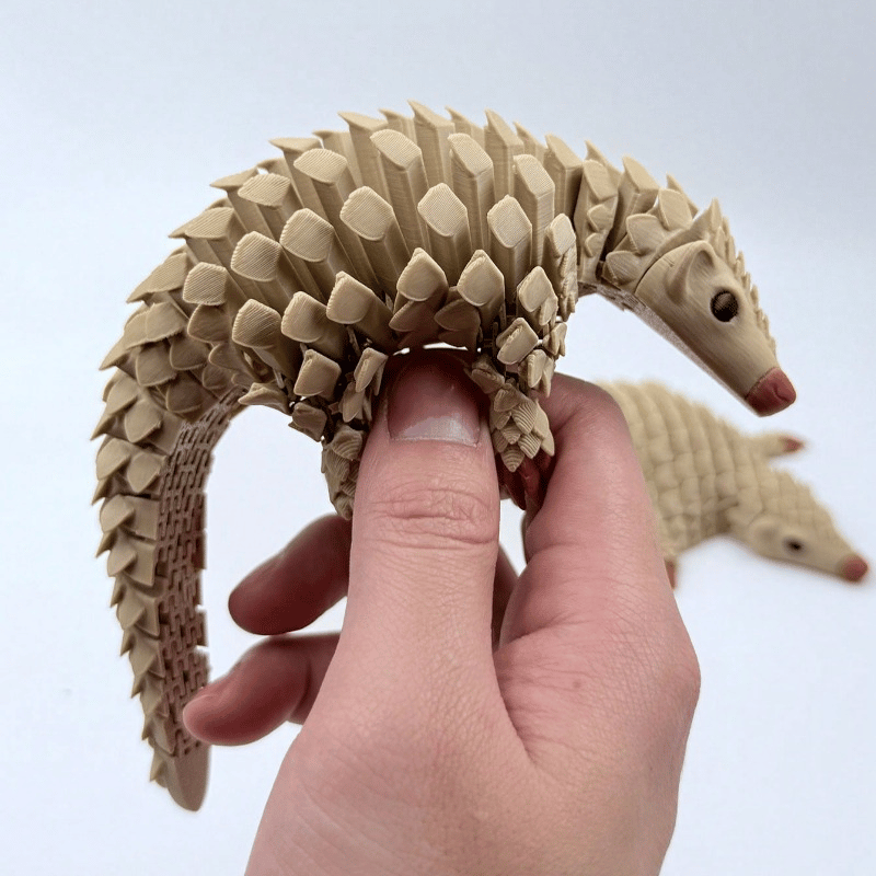Wiggling Pangolin Ornament – Delightful Motion for Your Home