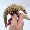 Wiggling Pangolin Ornament – Delightful Motion for Your Home