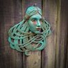 Art Nouveau inspired sculpture of beautiful female face with long stylised hair