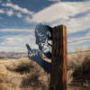Bigfoot metal art showing middle finger