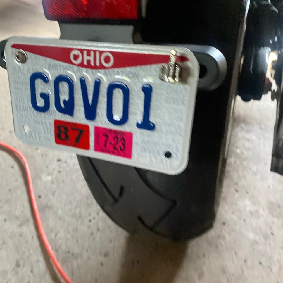 Universal finger license plate screw