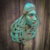 Art Nouveau inspired sculpture of beautiful female face with long stylised hair